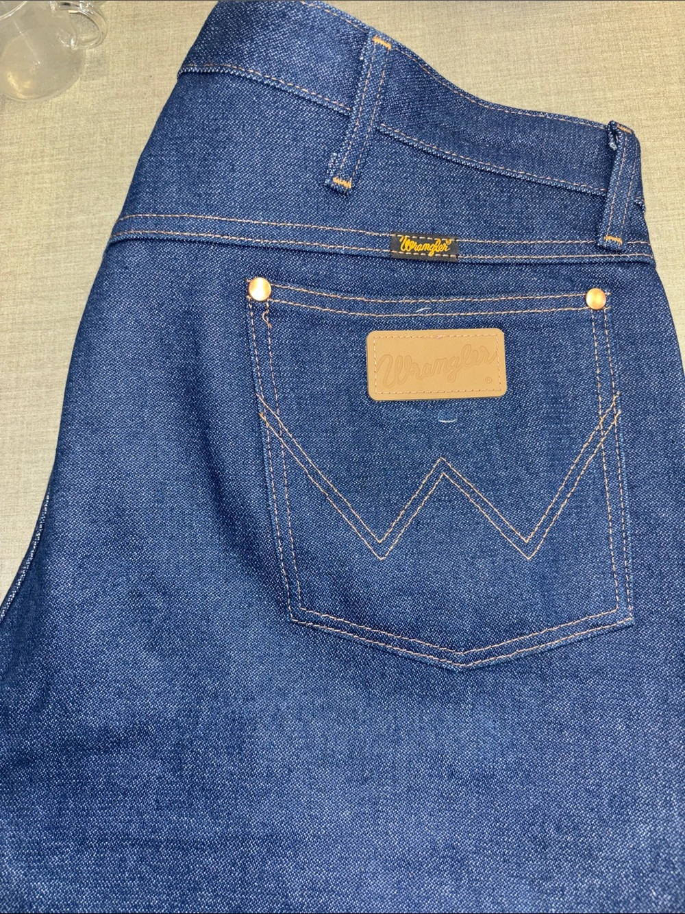 Wrangler Dark Blue mens 38x30 Jeans with Tan Patch